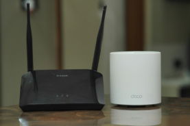 a-couple-of-routers-sitting-on-top-of-a-table.jpg a couple of routers sitting on top of a table